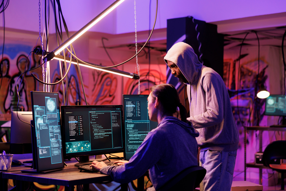 Hackers coding malicious software